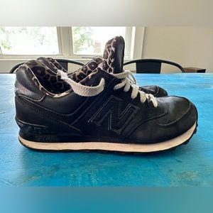 Women’s New Balance size 8.5 matte black outside, leopard inside. Used condition